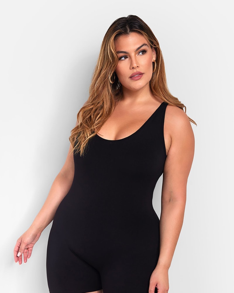 Side of a model wearing a size 1X Essential Tank Romper - Black in Black by Rebdolls. | dia_product_style_image_id:321354